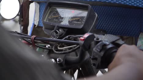 close up of filippino motorcycle driver steering