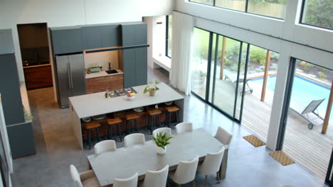 modern kitchen and dining area with large table and stylish chairs, copy space