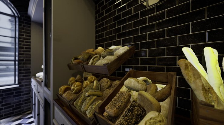Bakery display featuring a variety of fresh breads in a modern setting