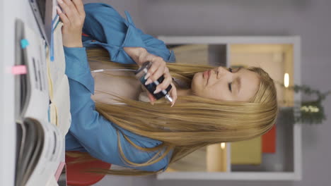 Vertical-video-of-A-Female-student-spraying-perfume.