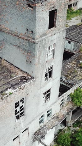 abandoned industrial building. ruins of an old factory. aerial view. vertical video