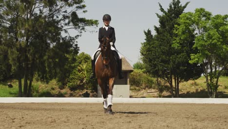 Caucasian-woman-riding-her-dressage-horse