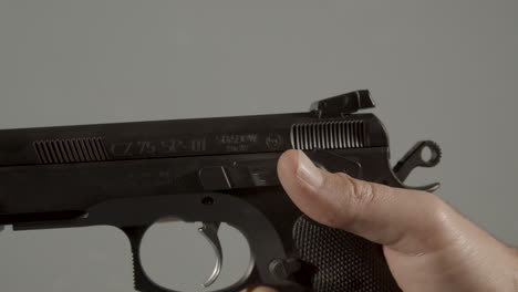 thumb flipping safety switch of pistol