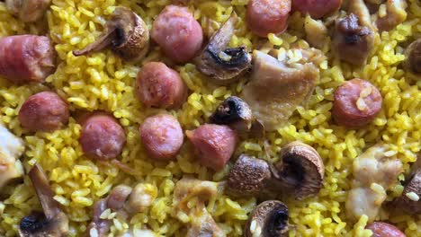 baked rice tray with meat, chicken and chickpeas