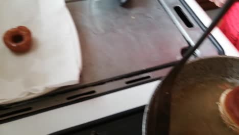 cooking homemade donuts as a family on a sunday