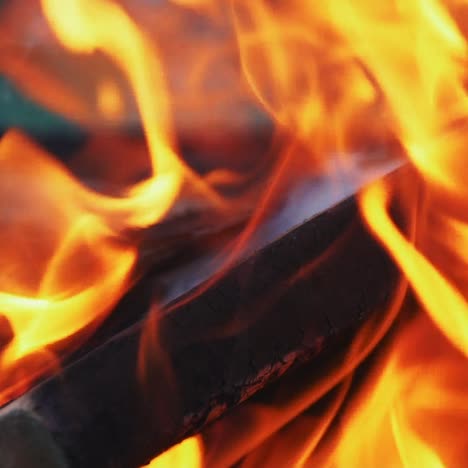 fire with wooden boards inside are burning in the street