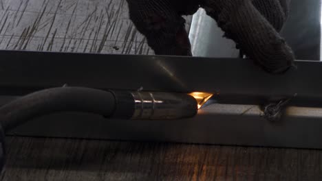 welder works in metal construction - construction and processing of steel components