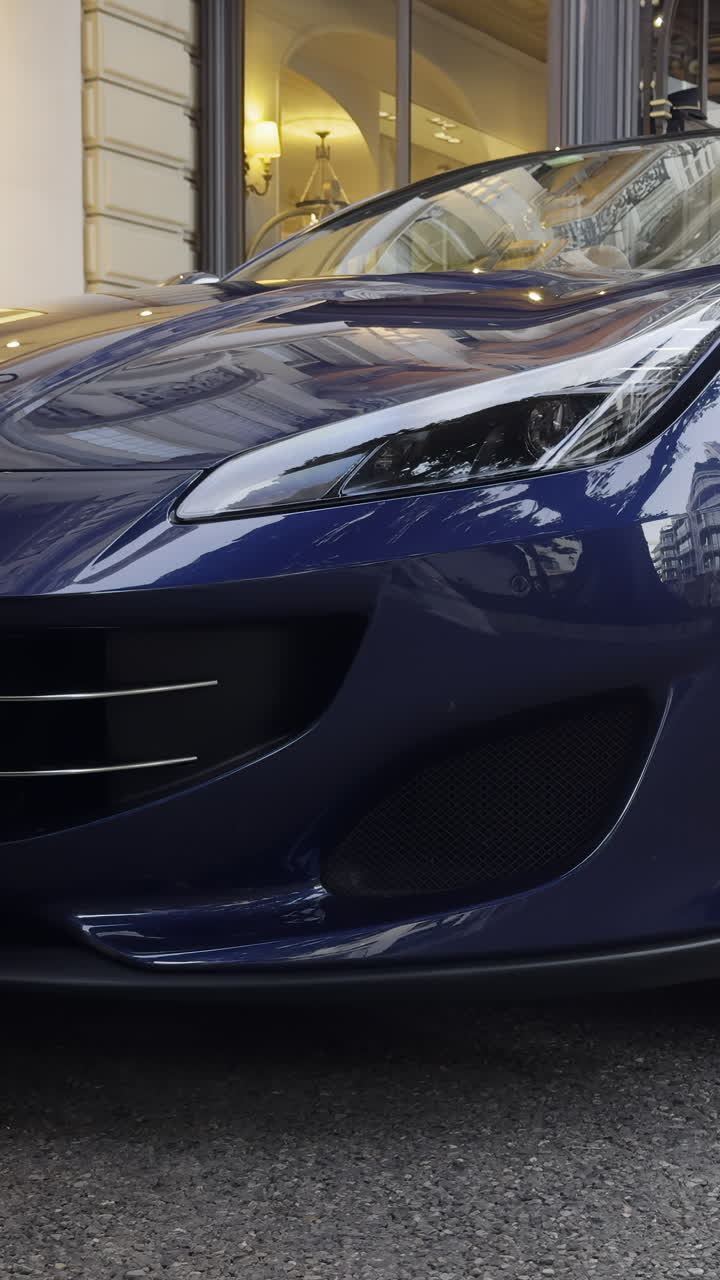 Front detail of a dark blue luxury sports car