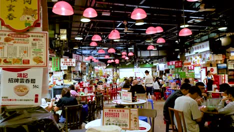 people dining and interacting in a bustling canteen