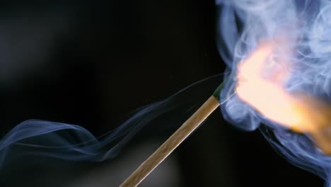 Burning-matchstick-close-up-on-a-dark-background.-Shot-on-super-slow-motion-camera-1000-fps.