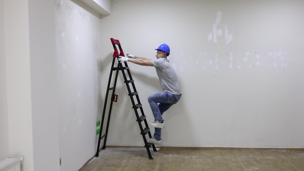 Worker climbing a ladder