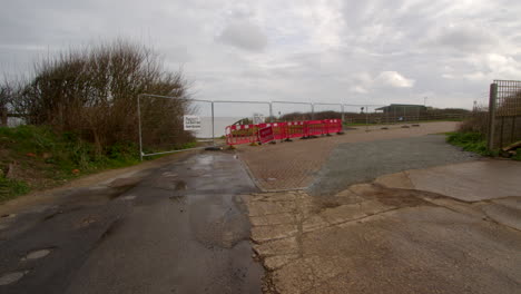 extra wide shot of beach rd showing its fallen over the cliff at happisburgh in march 2024