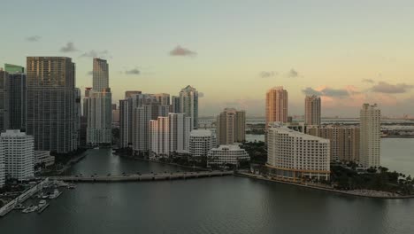 cinematic dolly aerial shot of brickell key in miami florida at sunset during golden hour