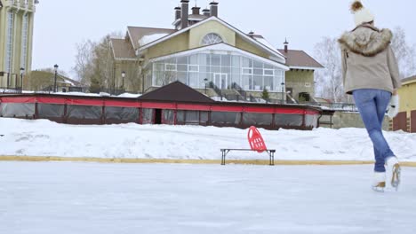 family having fun on ice rink