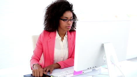 pretty designer working at her desk