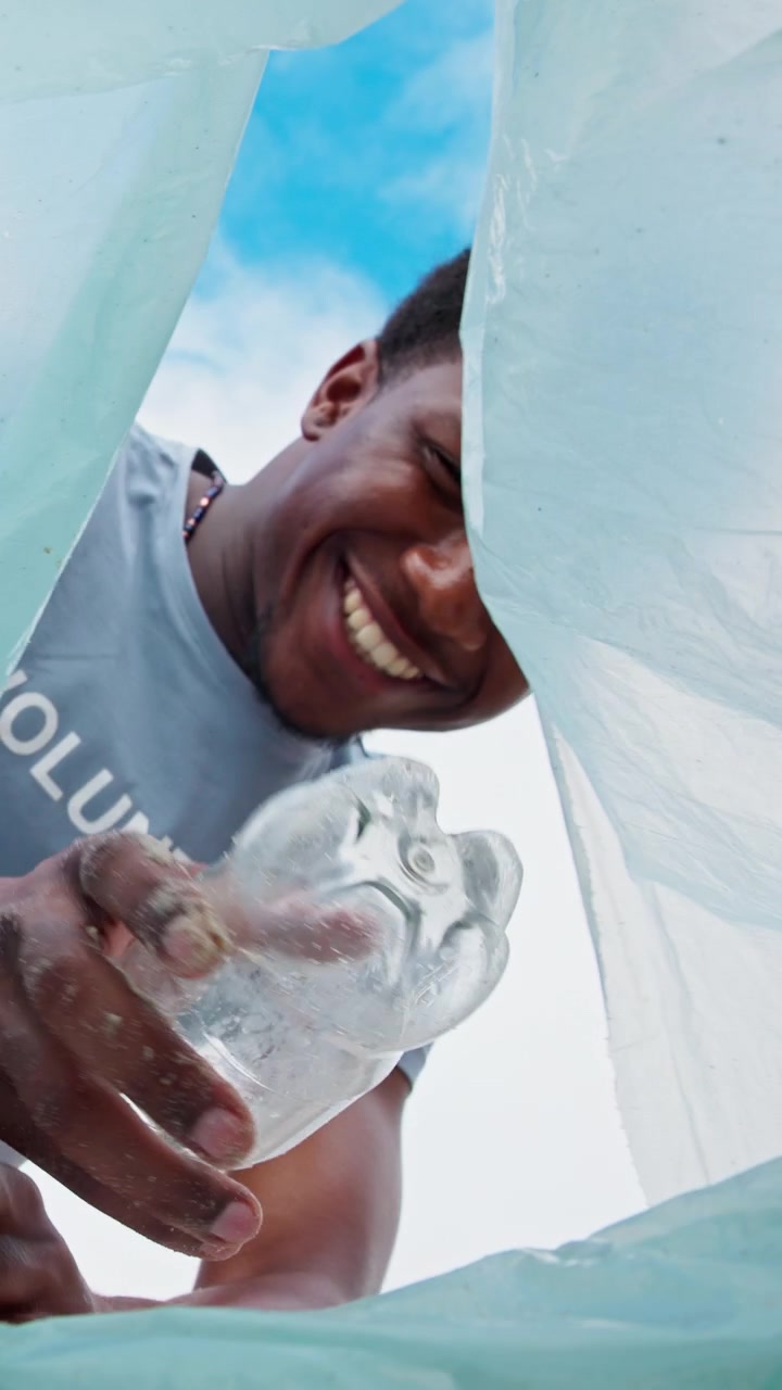 Volunteers Collecting Plastic Waste in Recycling Bag