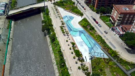 arial tilting shot of parques del río medellín, colombia