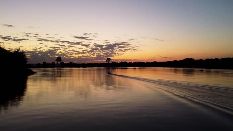 sunrise over the river with a boat
