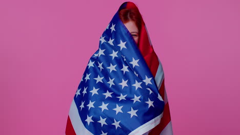 Cheerful-teen-girl-waving-and-wrapping-in-American-USA-flag,-celebrating,-human-rights-and-freedoms