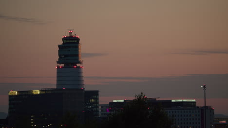 airplane landing at airport during sunset