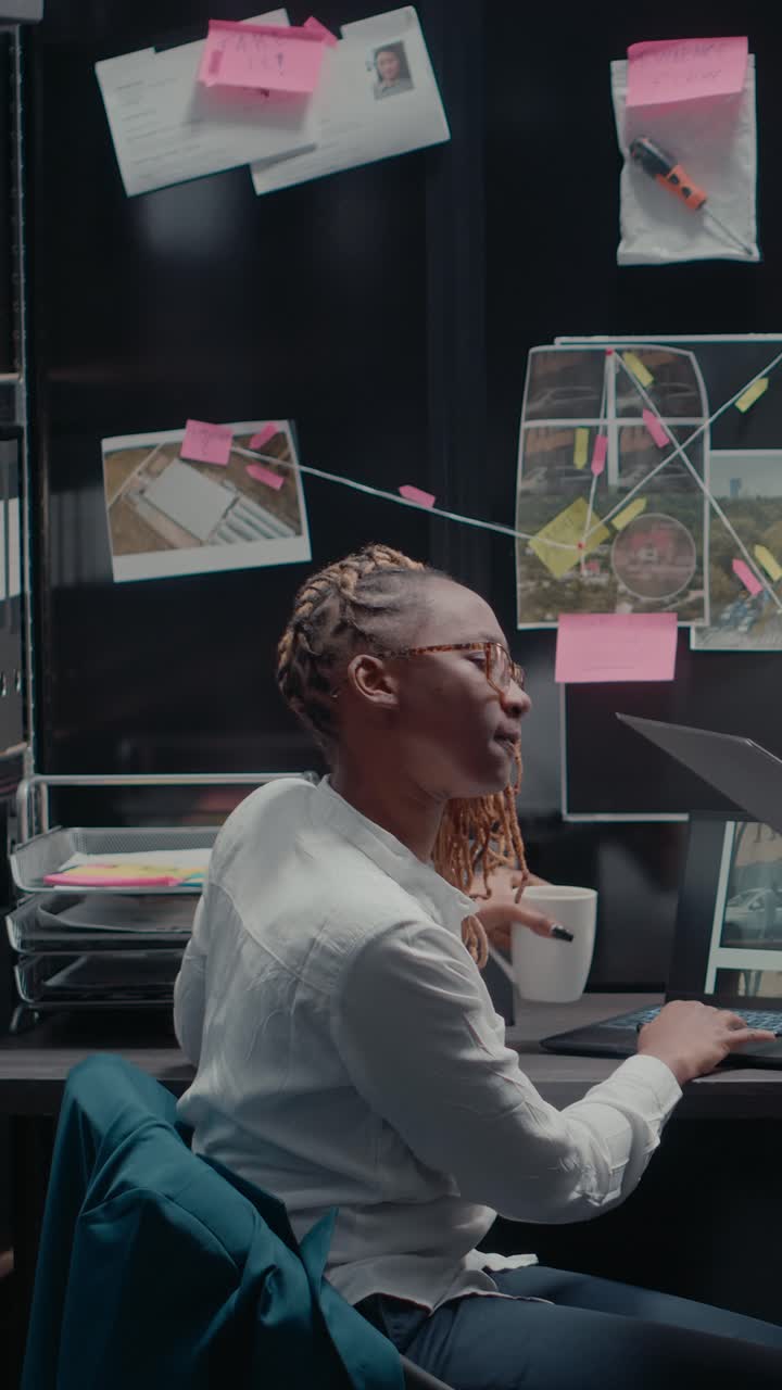Vertical video: African american law agents working with case evidence
