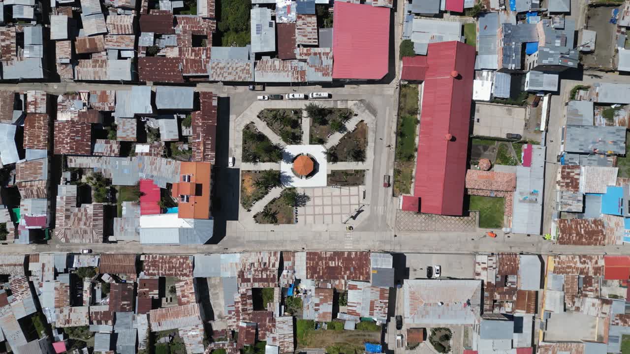 Quiet town street flyover: Cajatambo Plaza in mtns of Peru, aerial view