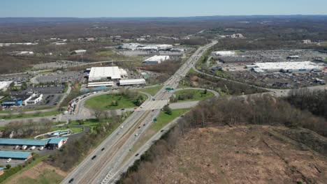 4K-Aerial-Drone-footage-of-industrial-shopping-centers-and-strip-malls-in-Middletown-New-York-and-traffics-can-be-seen-with-mountains-in-the-background