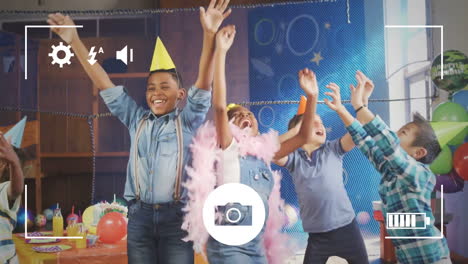 Taking-photos-of-children-at-birthday-party-on-a-digital-camera