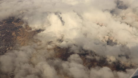 Handheld-shot-of-clouds-from-the-window-of-an-airplane