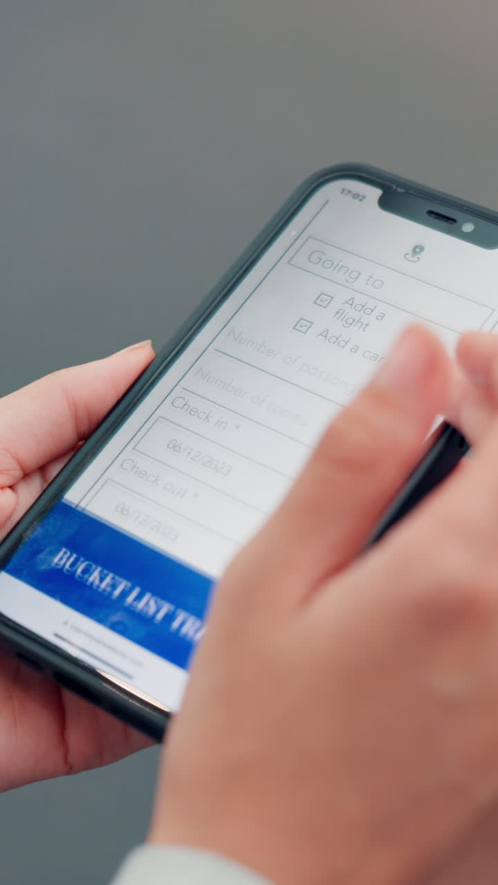 Close-Up of Hands Scrolling Through a Travel Planning App on a Smartphone