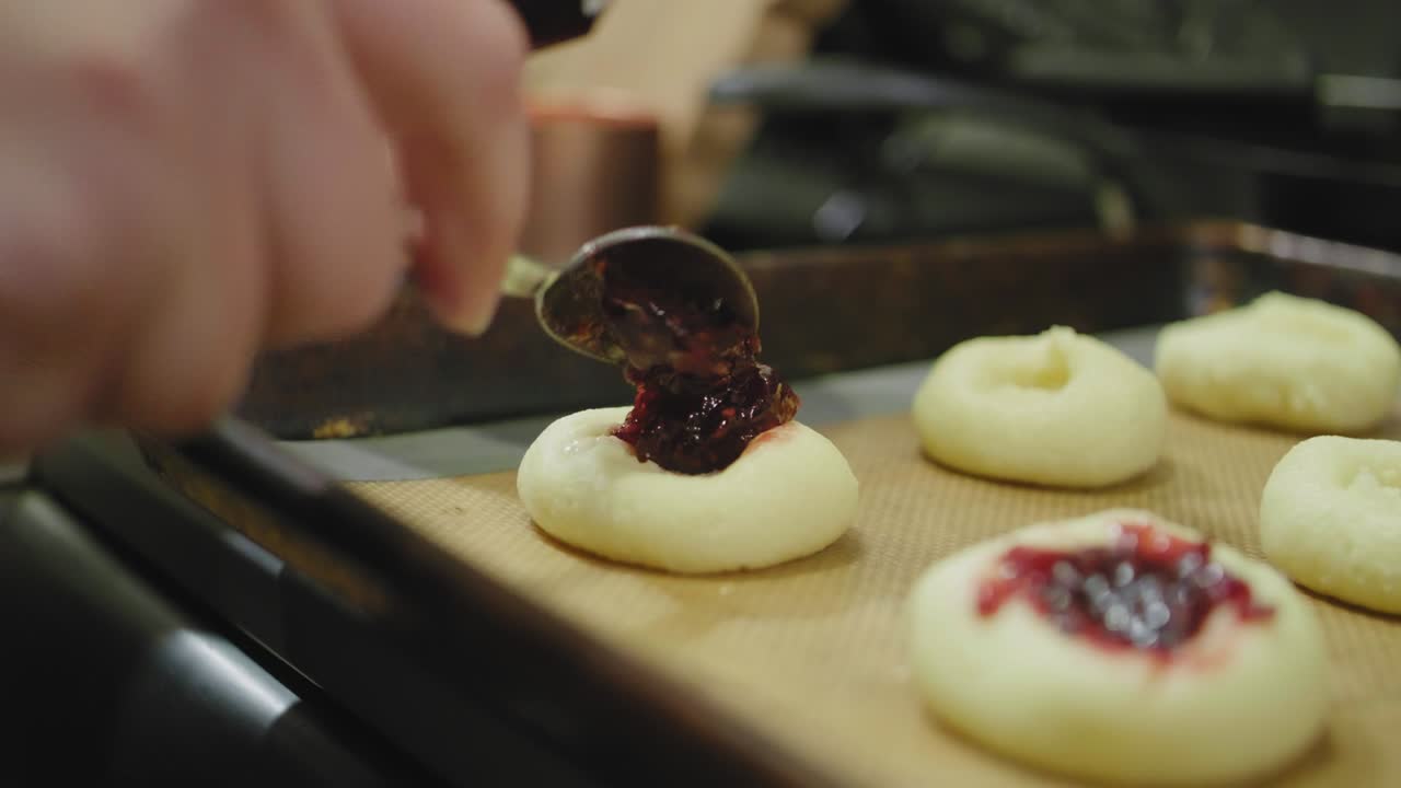 Filling Cookies with Raspberry Jam