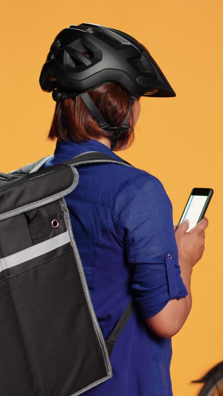 Delivery person using a phone