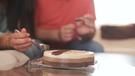 family sharing a birthday cake