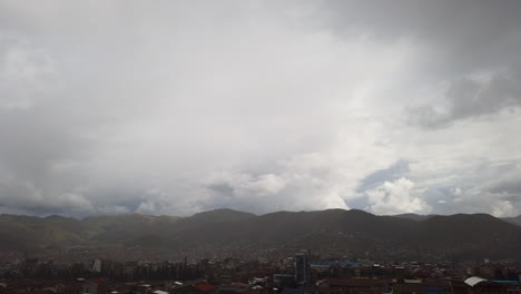 Orbital-timelapse-overlooking-the-Peruvian-Andes-and-the-city-of-Cusco,-Peru-in-a-cloudy-day