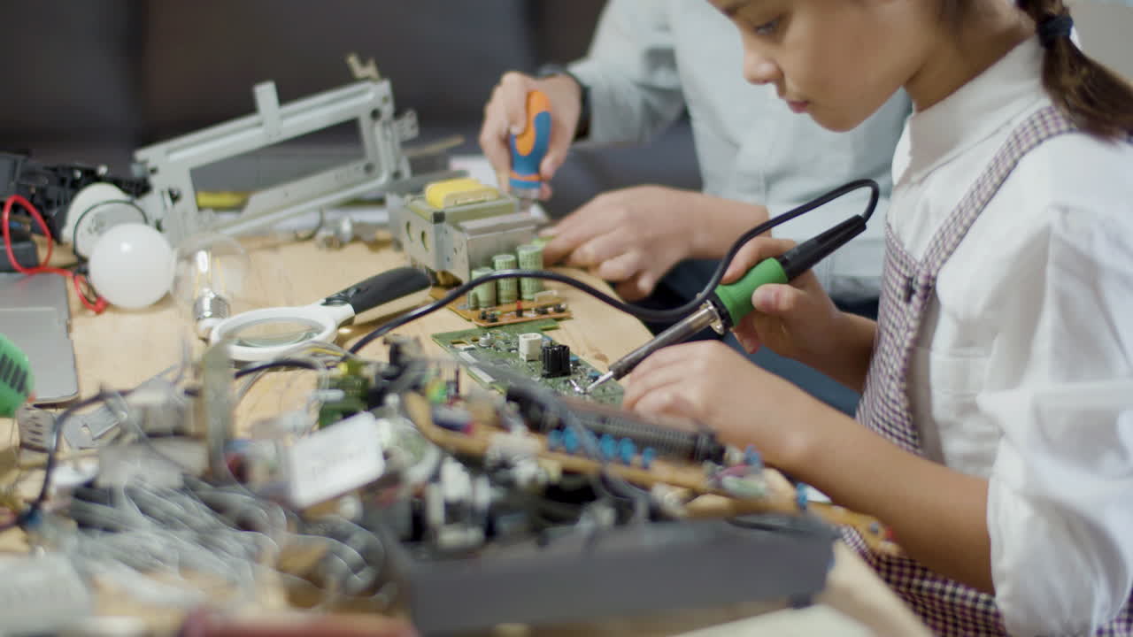 Two young classmates doing school project together