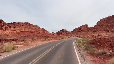 a scenic road winding through a breathtaking volcano landscape beneath a clear blue sky a picturesque road winding through volcanic terrain showcasing majestic rock formations and clear skies
