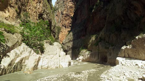 view from saklikent gorge canyon river to top of steep ravine cliffs jib shot