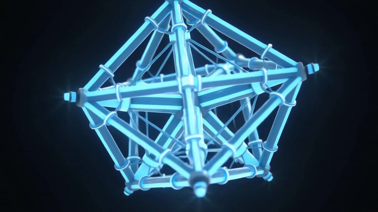 Rotating glowing polyhedral lattice on play in studio showing star core, tube struts and blue haze