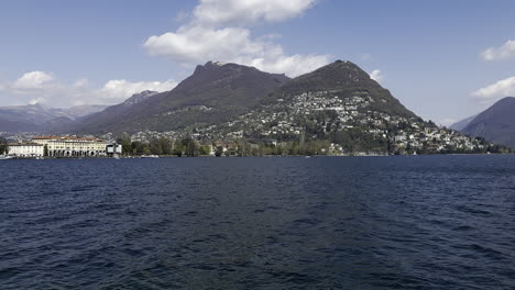 static view from the shores lake where lugano overlooks