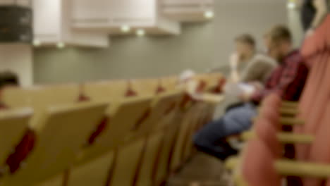 out-of-focus shot, group of caucasian male students fills classroom setting