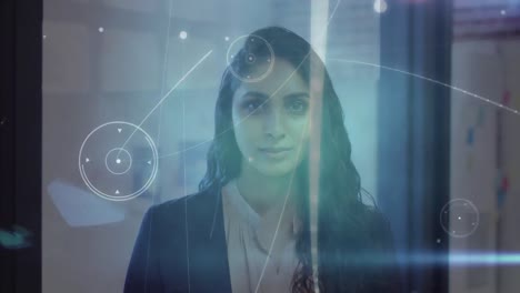 Network-of-connections-against-portrait-of-indian-woman-smiling-at-office