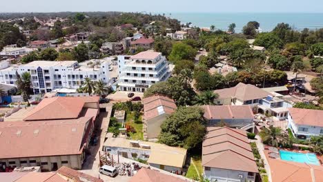 flying over ocean bay hotel area in cape point, bakau - the gambia