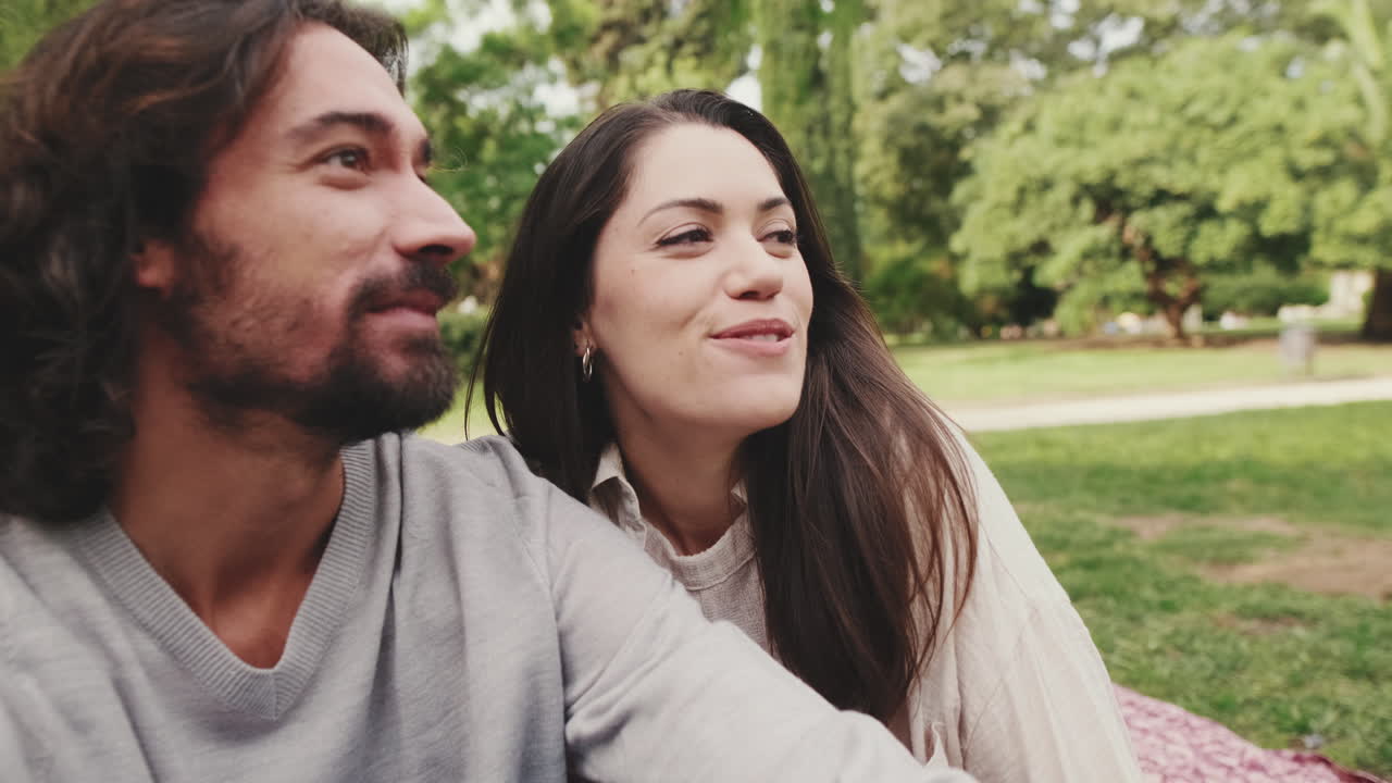 Couple enjoying a romantic picnic in the park