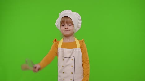 Child-girl-kid-cook-chef-baker-posing,-smiling,-showing-thumb-up-on-green-chroma-key-background