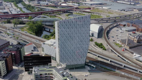 Iconic-office-building-apartment-house-tall-tower-skyscraper-central-downtown-Gothenburg-Swedish-city-Sweden-visit-Scandinavia-European-tourist-destination-reflective-architecture-freeway-spot-spots