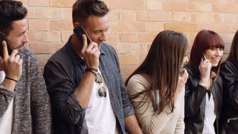 large group of friends on the phone. shot in slow motion