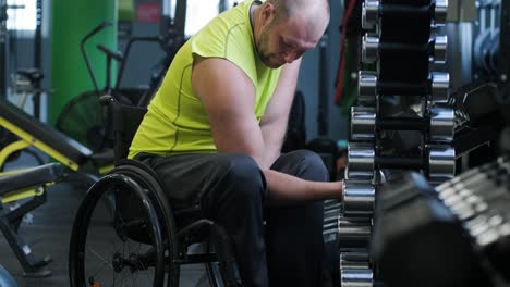 man with disabilities training in the gym of rehabilitation center