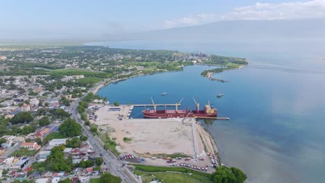 aerial view of cargo ship in barahona dock - new barahona cruise port will be built in dominican republic