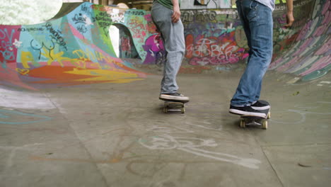 caucasian boys skateboarding in the park.