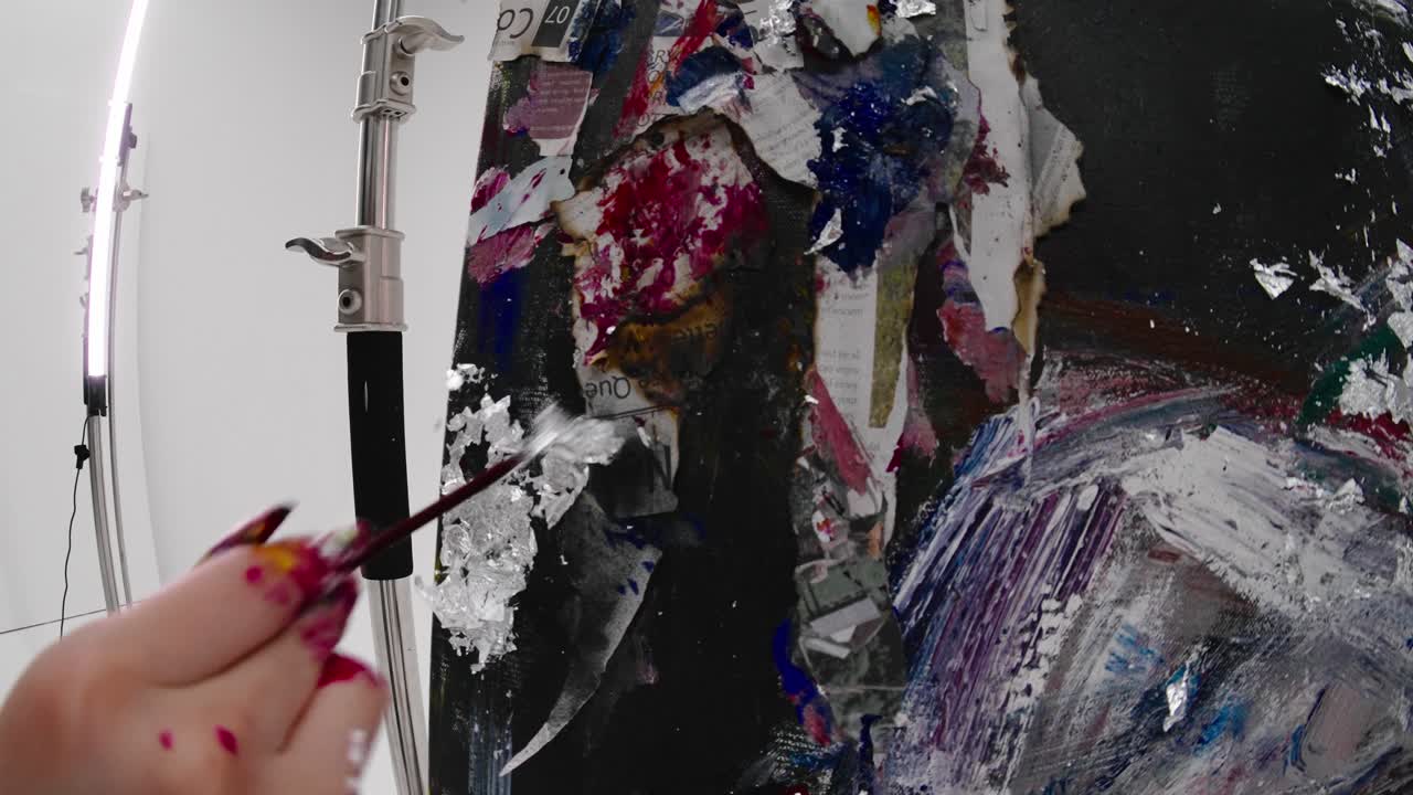 Artist painting a large canvas in slow motion. Detailed shot of dynamic brushstrokes. Contemporary artwork, mixed media techniques, fisheye effect. Behind-the-scenes of the creative painting process.